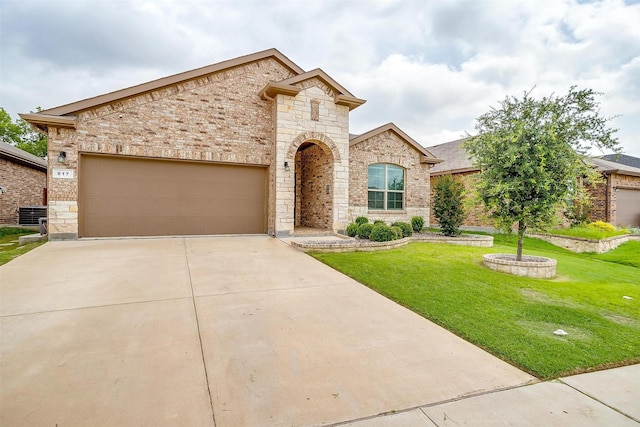 817 Nicole Way, Fort Worth, TX 76028 - french provincial home featuring a front yard, concrete driveway, an attached garage, and stone siding
