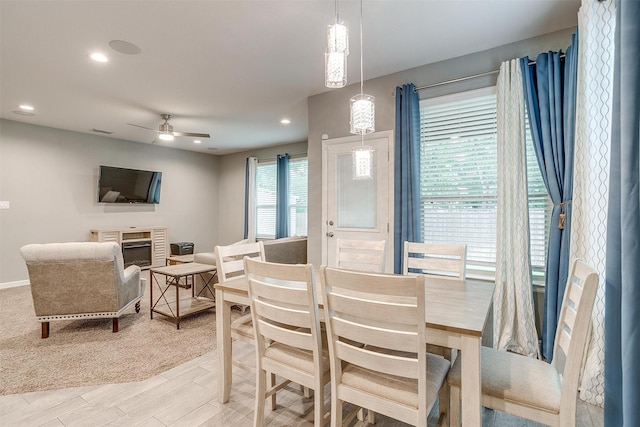 817 Nicole Way, Fort Worth, TX 76028 - dining space featuring ceiling fan, recessed lighting, wood finished floors, a fireplace, and baseboards
