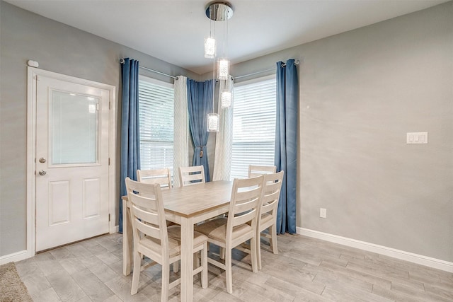 817 Nicole Way, Fort Worth, TX 76028 - dining space featuring plenty of natural light, light wood-style flooring, and baseboards