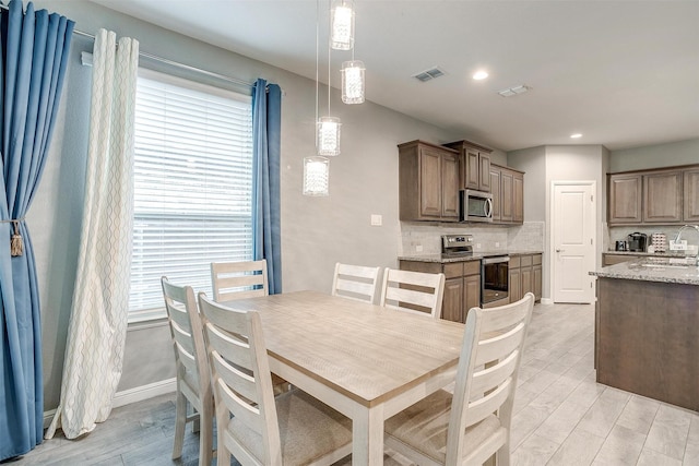 817 Nicole Way, Fort Worth, TX 76028 - dining room with light wood-style flooring, recessed lighting, and baseboards