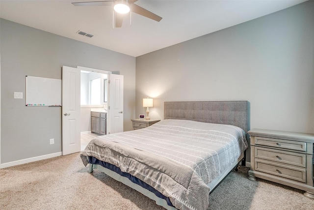 817 Nicole Way, Fort Worth, TX 76028 - bedroom featuring light carpet, baseboards, ensuite bathroom, and ceiling fan