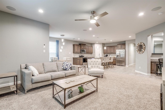 817 Nicole Way, Fort Worth, TX 76028 - living area featuring ceiling fan, light colored carpet, baseboards, and recessed lighting