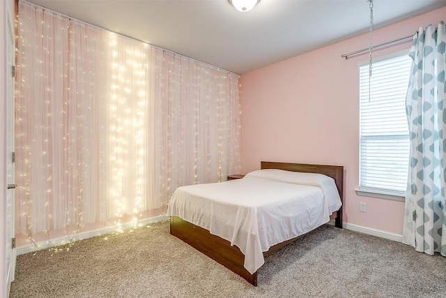 817 Nicole Way, Fort Worth, TX 76028 - carpeted bedroom featuring multiple windows and baseboards