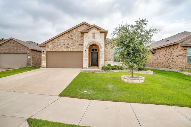 817 Nicole Way, Fort Worth, TX 76028 - french country style house featuring a front lawn, concrete driveway, an attached garage, and stone siding