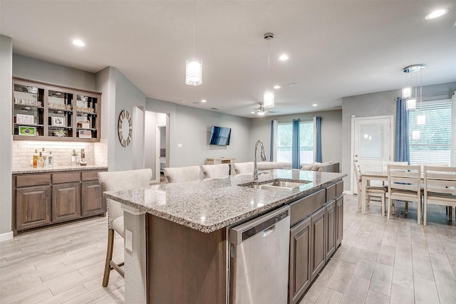 817 Nicole Way, Fort Worth, TX 76028 - kitchen with dishwasher, a sink, light wood finished floors, a center island with sink, and recessed lighting