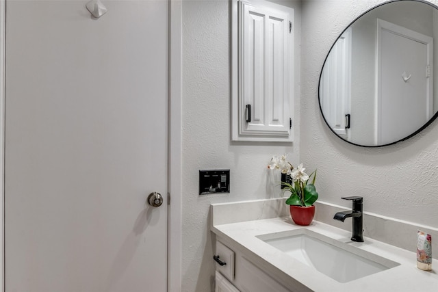 4000 Via Plata, Mesquite, TX 75150 - bathroom with vanity and a textured wall