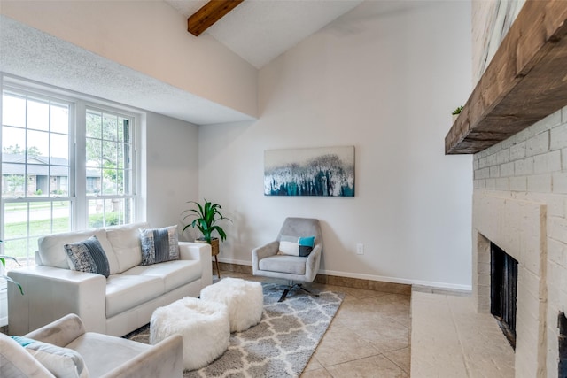 4000 Via Plata, Mesquite, TX 75150 - tiled living area featuring a fireplace, beam ceiling, high vaulted ceiling, and baseboards