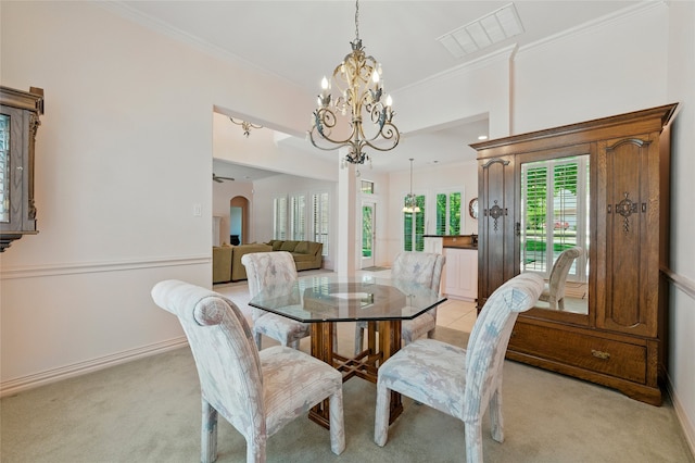2004 Kodiak Ct, Arlington, TX 76013 - dining area with a chandelier, light carpet, arched walkways, and crown molding