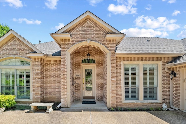 2004 Kodiak Ct, Arlington, TX 76013 - doorway to property with brick siding and roof with shingles