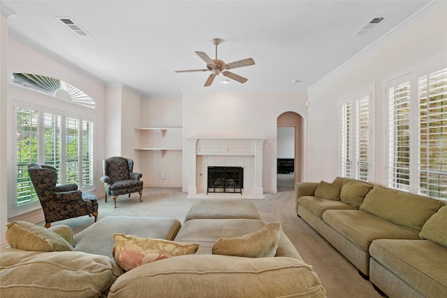 2004 Kodiak Ct, Arlington, TX 76013 - living area with arched walkways, built in shelves, ornamental molding, a ceiling fan, and light carpet