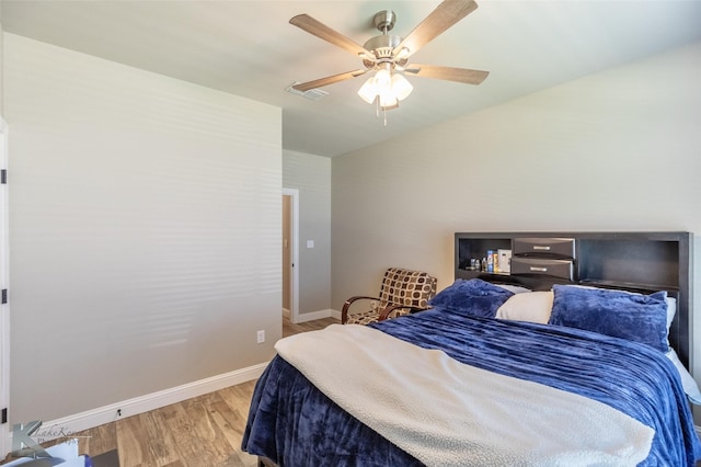 357 Blue Lake Dr, Abilene, TX 79602 - bedroom featuring wood finished floors, baseboards, and ceiling fan