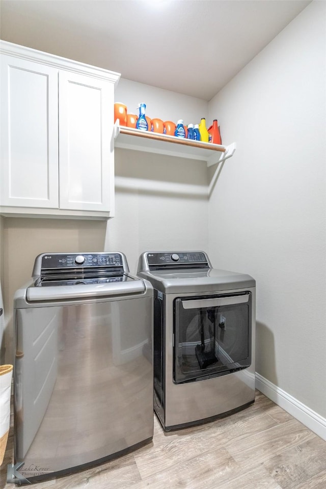 357 Blue Lake Dr, Abilene, TX 79602 - laundry room featuring independent washer and dryer, cabinet space, light wood-style floors, and baseboards