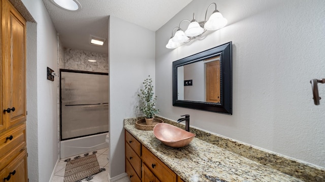 5691 Priscilla Ln, Kaufman, TX 75142 - full bathroom with vanity, tile patterned floors, enclosed tub / shower combo, toilet, and a textured ceiling