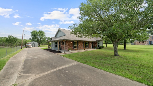 5691 Priscilla Ln, Kaufman, TX 75142 - view of front of house featuring a porch, brick siding, a shingled roof, and driveway