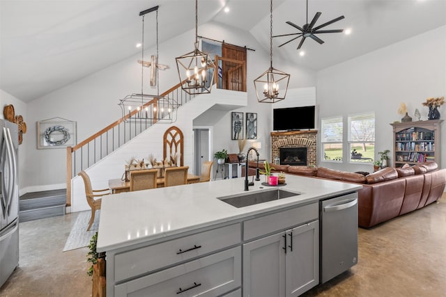 243 Fm 203, Walnut Springs, TX 76690 - kitchen featuring a sink, appliances with stainless steel finishes, concrete flooring, open floor plan, and high vaulted ceiling