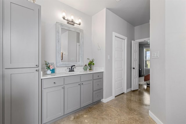 243 Fm 203, Walnut Springs, TX 76690 - bathroom featuring finished concrete flooring, vanity, and baseboards