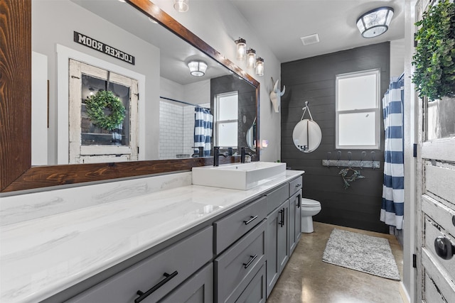 243 Fm 203, Walnut Springs, TX 76690 - bathroom with concrete flooring, vanity, toilet, and a shower with shower curtain
