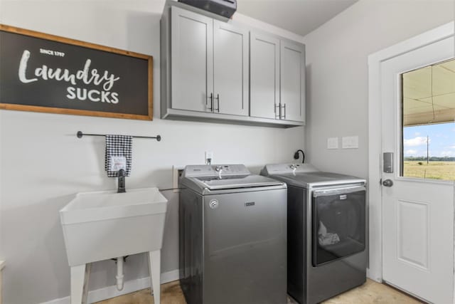 243 Fm 203, Walnut Springs, TX 76690 - laundry room with cabinet space, washing machine and clothes dryer, and baseboards