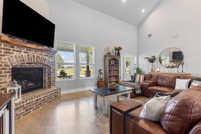 243 Fm 203, Walnut Springs, TX 76690 - living area featuring high vaulted ceiling, concrete flooring, a brick fireplace, baseboards, and recessed lighting