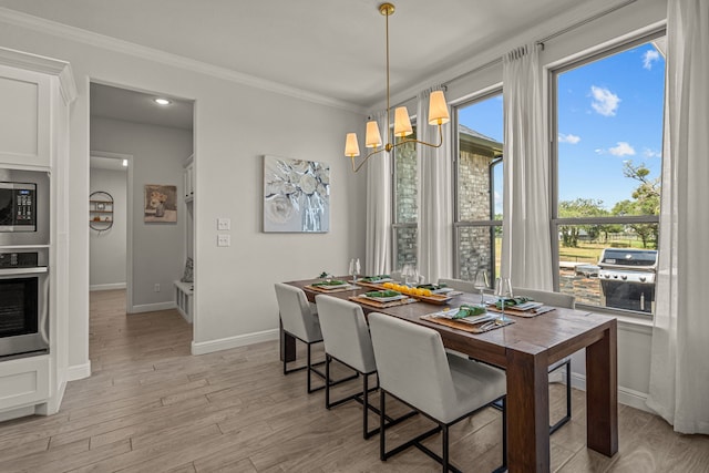 381 Oak Meadow Ln, Weatherford, TX 76085 - dining space featuring a chandelier, crown molding, baseboards, and light wood finished floors