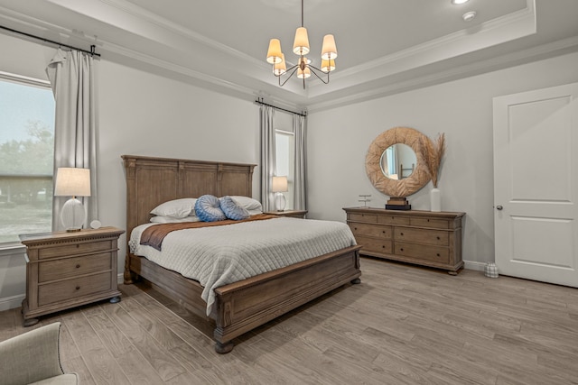 381 Oak Meadow Ln, Weatherford, TX 76085 - bedroom with a raised ceiling, light wood-style floors, a chandelier, crown molding, and baseboards