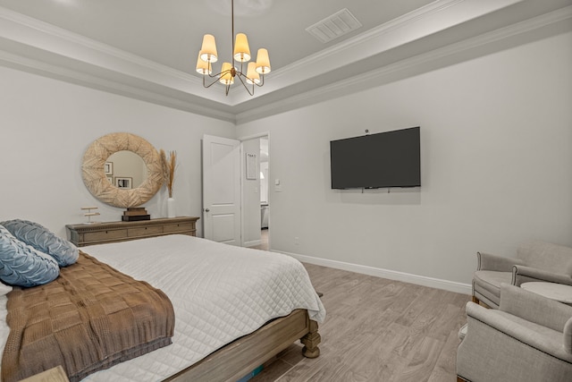 381 Oak Meadow Ln, Weatherford, TX 76085 - bedroom with a chandelier, wood finished floors, crown molding, baseboards, and a raised ceiling