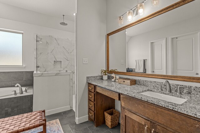 381 Oak Meadow Ln, Weatherford, TX 76085 - full bathroom with vanity, a marble finish shower, a bath, tile patterned floors, and baseboards