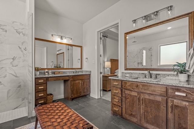 381 Oak Meadow Ln, Weatherford, TX 76085 - bathroom featuring a marble finish shower and two vanities