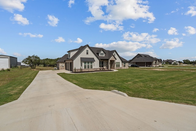 381 Oak Meadow Ln, Weatherford, TX 76085 - view of front facade featuring a front yard, stone siding, board and batten siding, and concrete driveway
