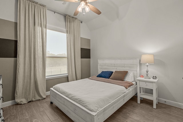 381 Oak Meadow Ln, Weatherford, TX 76085 - bedroom with wood finished floors, baseboards, vaulted ceiling, and a ceiling fan