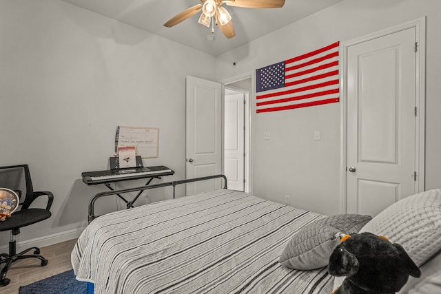 381 Oak Meadow Ln, Weatherford, TX 76085 - bedroom with wood finished floors, baseboards, and a ceiling fan