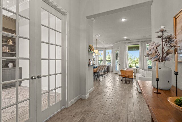 381 Oak Meadow Ln, Weatherford, TX 76085 - hall with wood finished floors, baseboards, french doors, and recessed lighting