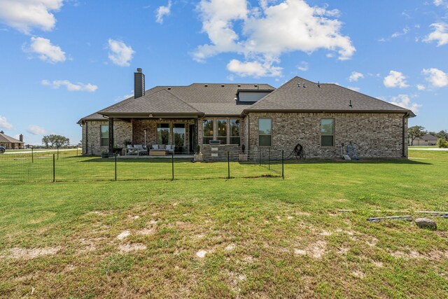381 Oak Meadow Ln, Weatherford, TX 76085 - back of house with a chimney, brick siding, a patio, and roof with shingles