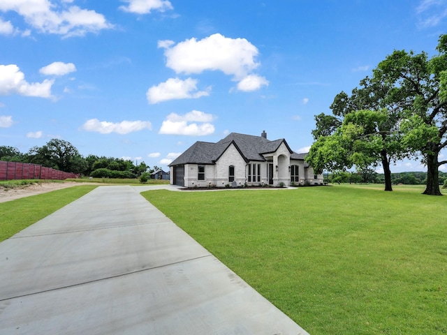 161 Altom Rd, Springtown, TX 76082 - french country home with concrete driveway and a garage