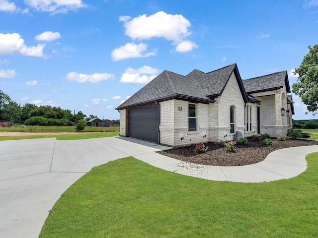 161 Altom Rd, Springtown, TX 76082 - view of side of home with concrete driveway, brick siding, a lawn, and roof with shingles