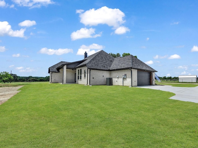 161 Altom Rd, Springtown, TX 76082 - view of home's exterior featuring concrete driveway, a yard, a garage, a chimney, and brick siding