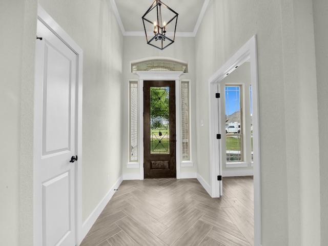 161 Altom Rd, Springtown, TX 76082 - foyer entrance with ornamental molding, baseboards, and a chandelier