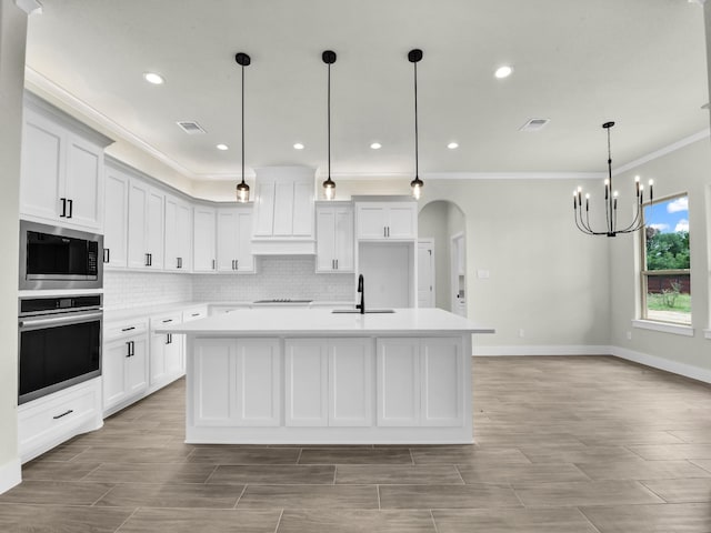 161 Altom Rd, Springtown, TX 76082 - kitchen with appliances with stainless steel finishes, ornamental molding, a sink, a chandelier, and decorative backsplash
