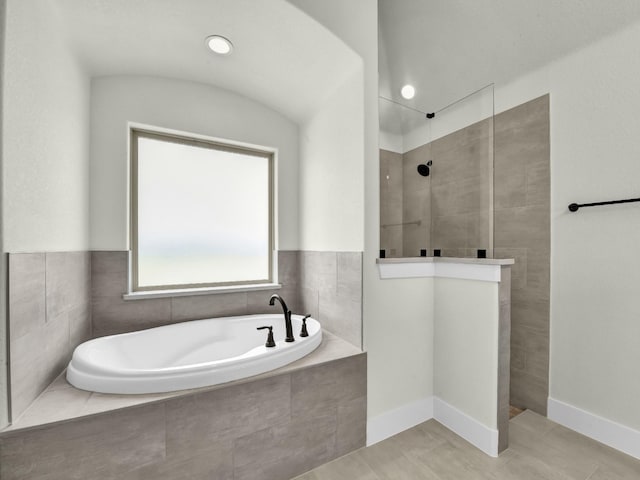 161 Altom Rd, Springtown, TX 76082 - full bathroom with a garden tub, walk in shower, and tile patterned flooring