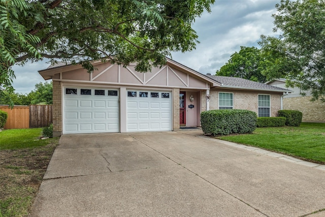 2315 Yale Dr, Arlington, TX 76015 - view of front of property featuring an attached garage, driveway, and brick siding