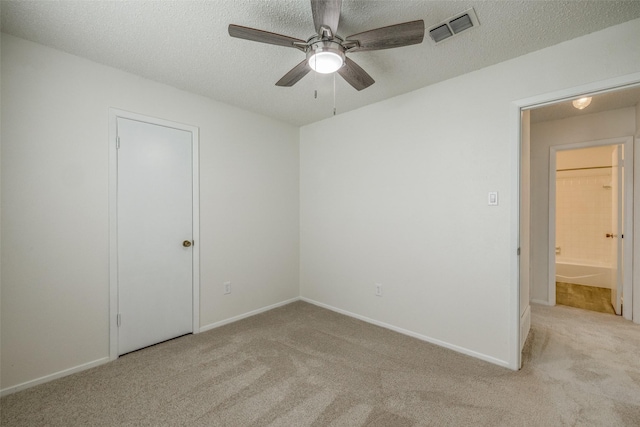 2315 Yale Dr, Arlington, TX 76015 - unfurnished bedroom featuring carpet floors, a textured ceiling, baseboards, and ceiling fan