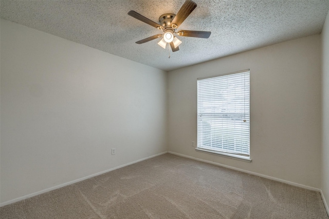2315 Yale Dr, Arlington, TX 76015 - spare room featuring a ceiling fan, carpet, a textured ceiling, and baseboards