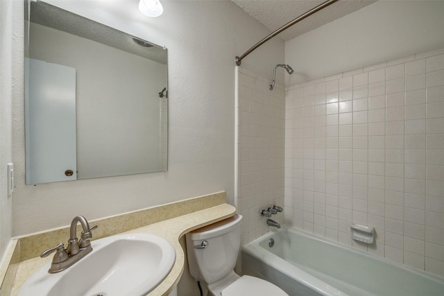 2315 Yale Dr, Arlington, TX 76015 - bathroom with toilet, shower / bath combination, a textured ceiling, and vanity