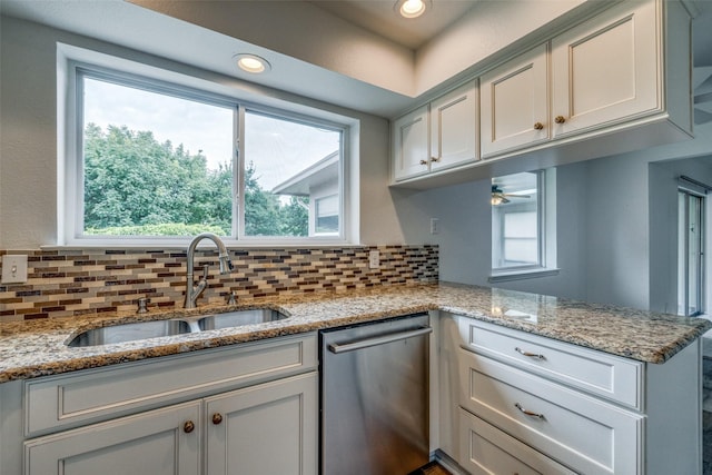 2315 Yale Dr, Arlington, TX 76015 - kitchen with stainless steel dishwasher, a sink, tasteful backsplash, recessed lighting, and a ceiling fan