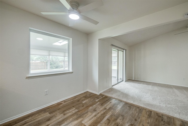 2315 Yale Dr, Arlington, TX 76015 - unfurnished room featuring baseboards, ceiling fan, wood finished floors, and vaulted ceiling