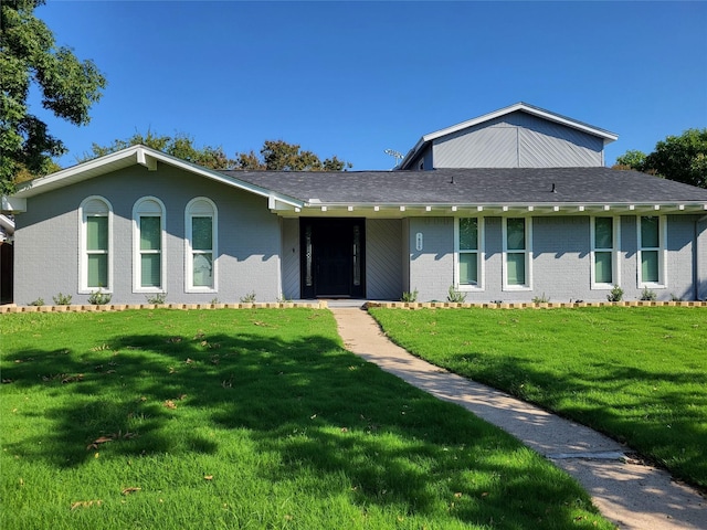 1605 Baltimore Dr, Richardson, TX 75081 - view of front of home featuring brick siding and a front yard
