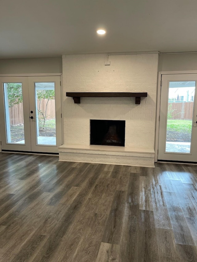 1605 Baltimore Dr, Richardson, TX 75081 - unfurnished living room with a fireplace, wood finished floors, french doors, and recessed lighting