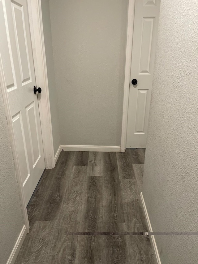 1605 Baltimore Dr, Richardson, TX 75081 - hall with wood finished floors, baseboards, and a textured wall