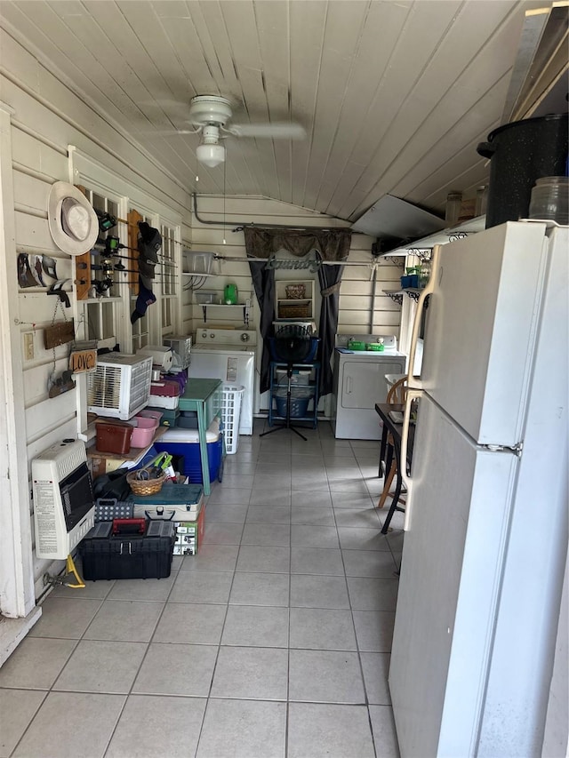 567 N Rice, Hamilton, TX 76531 - kitchen with freestanding refrigerator, washer / clothes dryer, heating unit, and tile patterned floors