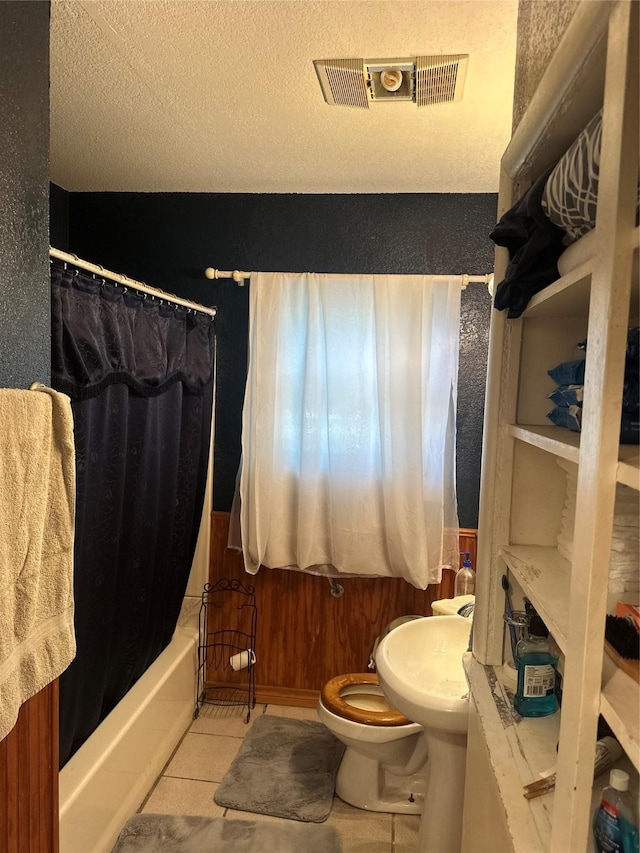 567 N Rice, Hamilton, TX 76531 - full bath with toilet, shower / bath combination with curtain, and tile patterned flooring